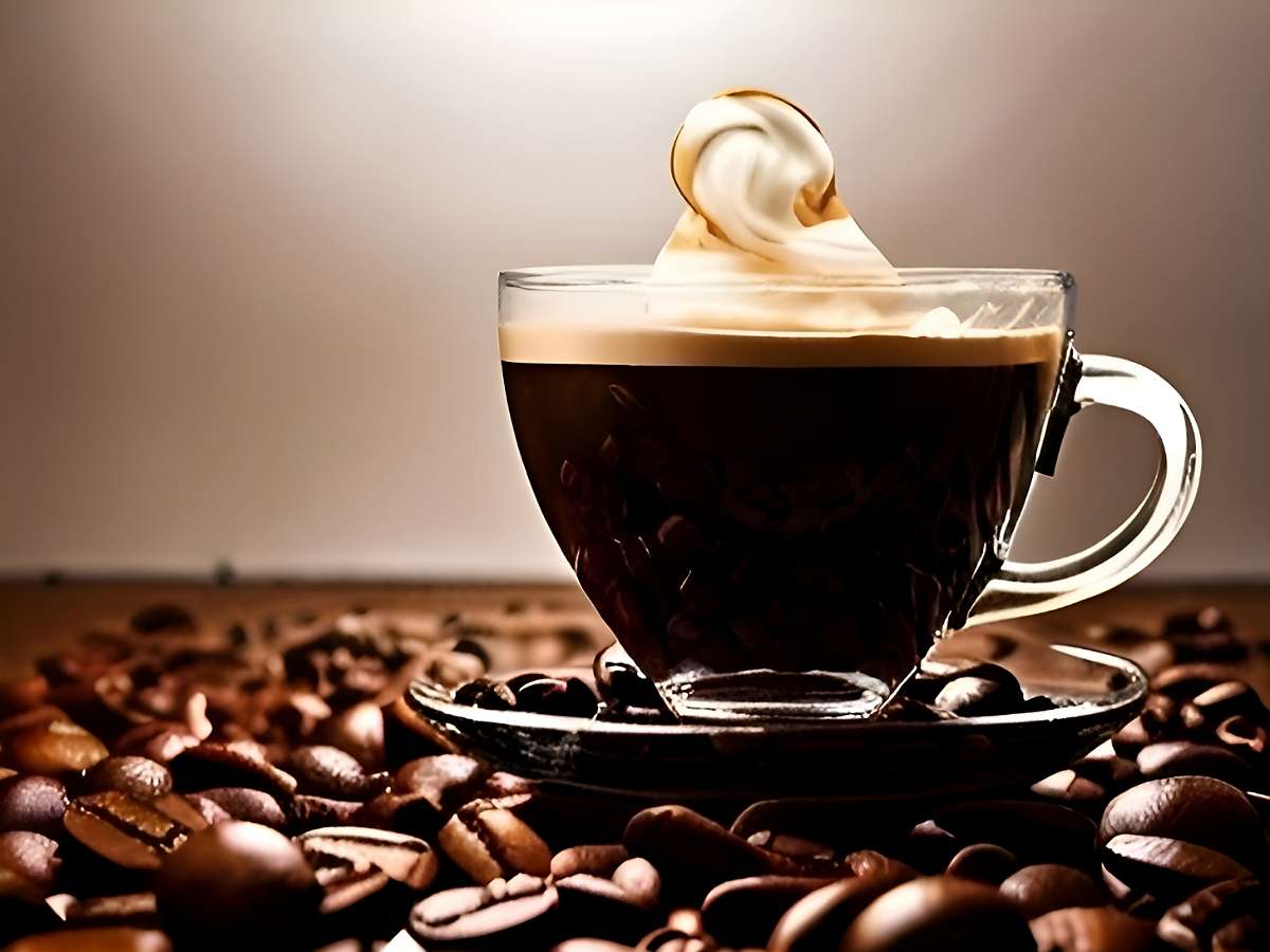 Cup of specialty grade coffee on arabica coffee beans visual for coffee blog article of the week
