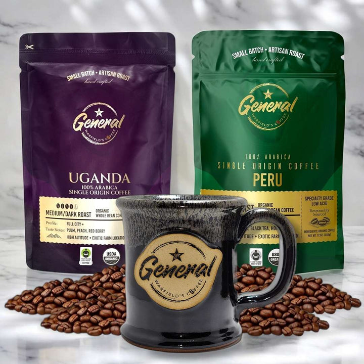 Organic Coffee Brew Bundle featured on marble surface highlighting the Organic certified Peruvian and Ugandan roasts with lead-free and cadmium-free handcrafted 14oz mug.